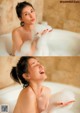 A woman in a bathtub with foam on her face.