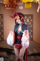 A woman dressed in a chinese costume posing for a picture.