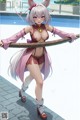 A woman in a bunny costume holding a stick by a pool.